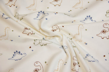 Jersey mit Dinosauriern, ecru, 0,5 m